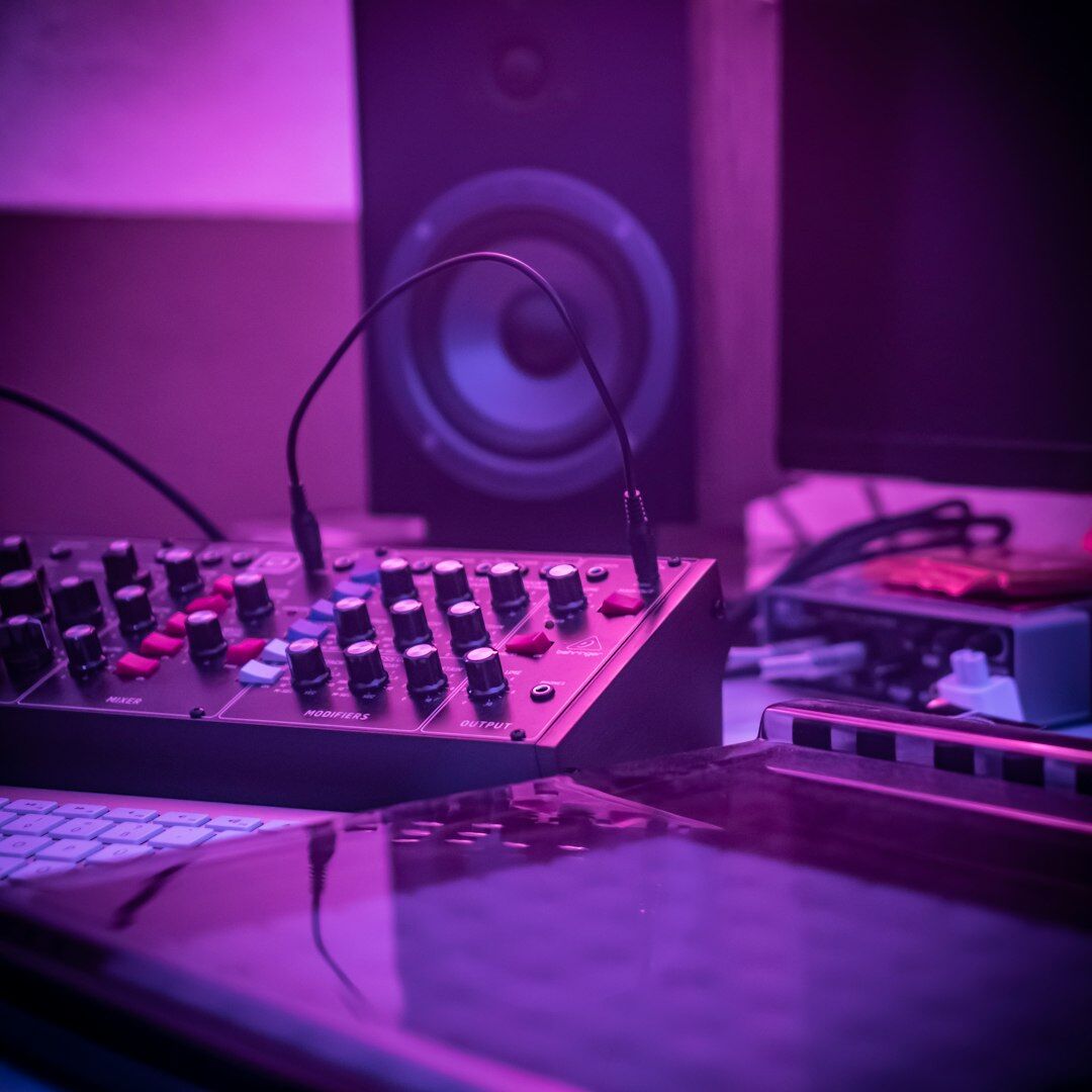 Male sound engineer adjusting audio equipment in studio